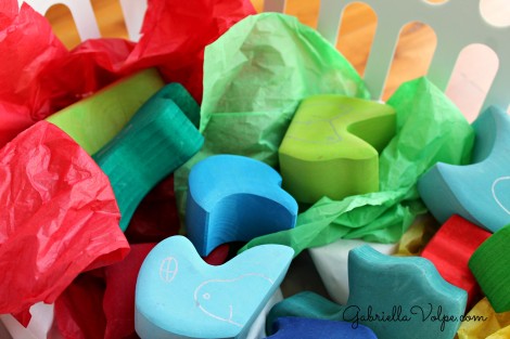 colorful wooden blocks and tissue paper in sensory box for child with special needs